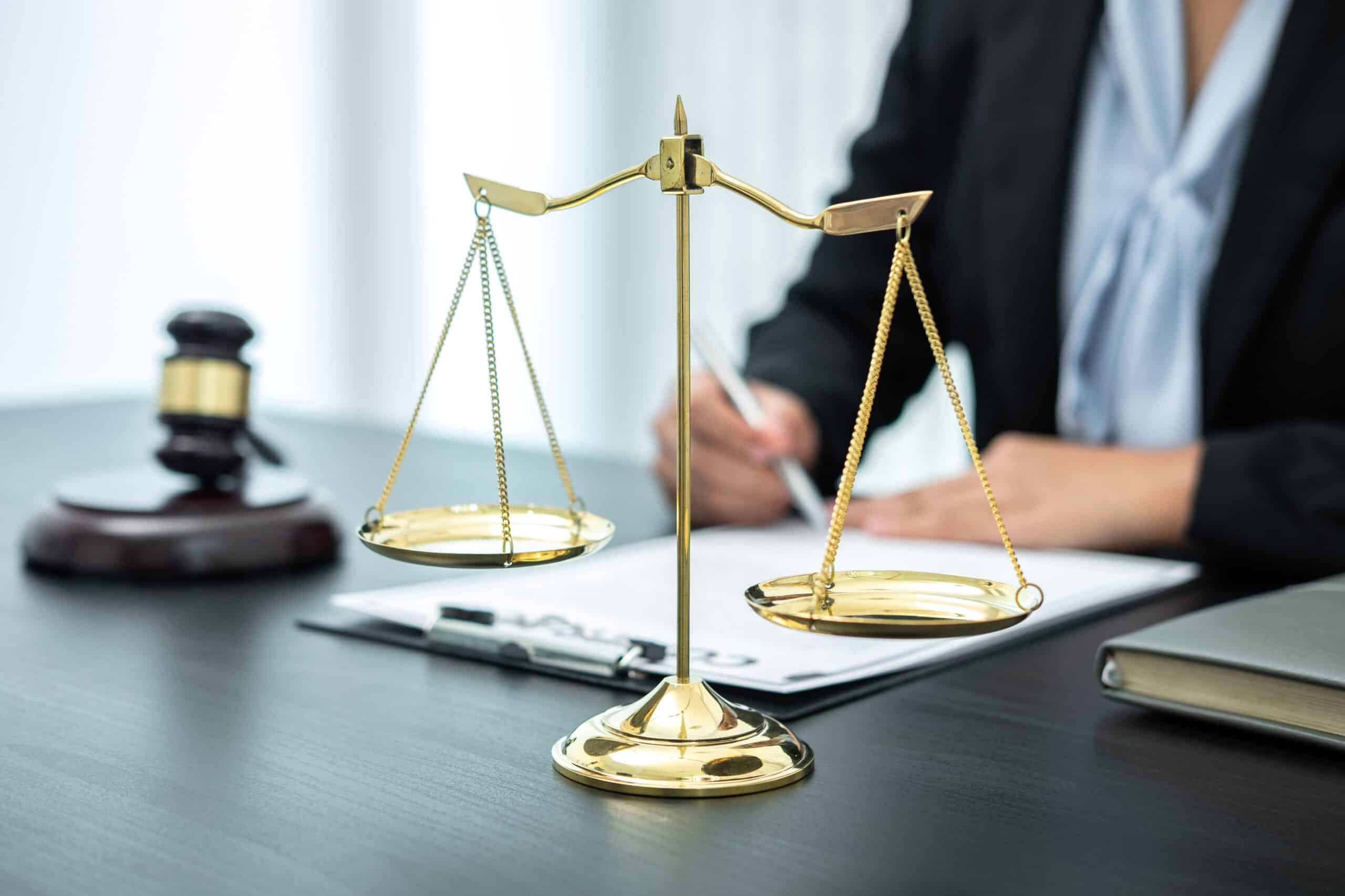 Female lawyer working with legal case document contract in offic